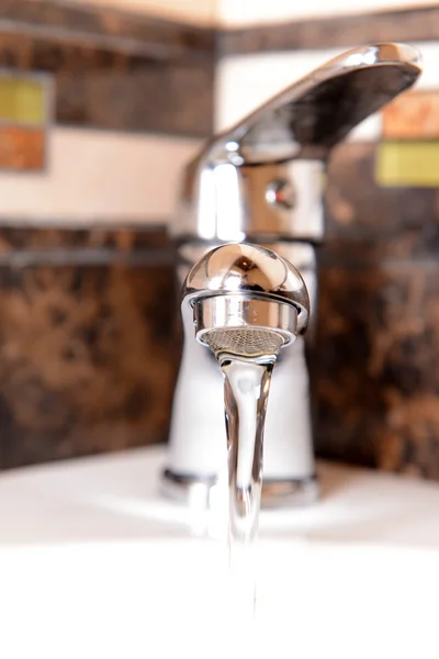 Ceramic sink with chrome fixture, close up — Stock Photo, Image