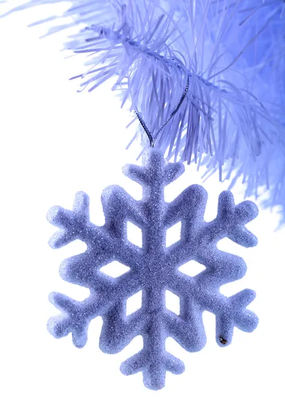 Christmas snowflake on snow-white Christmas tree close-up isolated on white — Stock Photo, Image