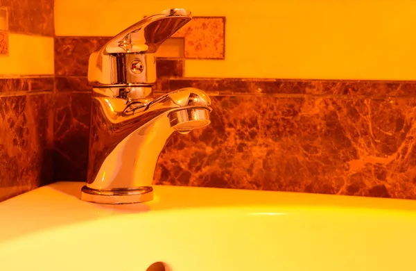 Ceramic sink with chrome fixture, close up — Stock Photo, Image