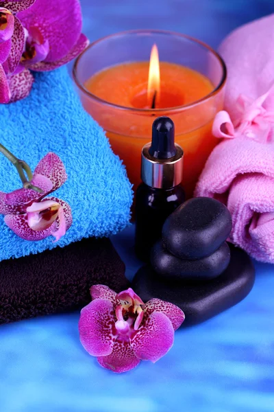 Beautiful spa setting with orchid on blue background — Stock Photo, Image