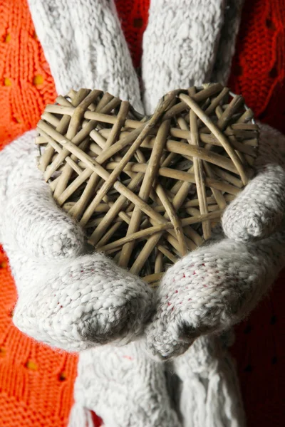 Female hands in mittens with heart, close-up — Stock Photo, Image