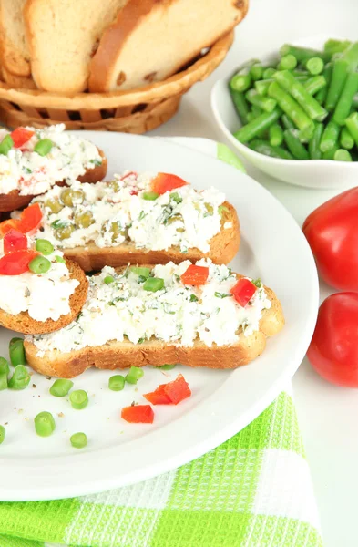 Sandwiches with cottage cheese and greens on plate isolated on white — Stock Photo, Image