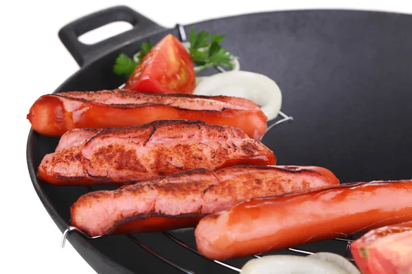 Delicious sausages in wok isolated on white — Stock Photo, Image