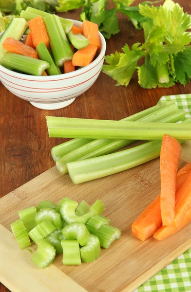 Fresh green celery with vegetables on table close-up — Stock Photo, Image