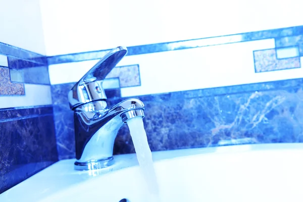 Ceramic sink with chrome fixture, close up — Stock Photo, Image