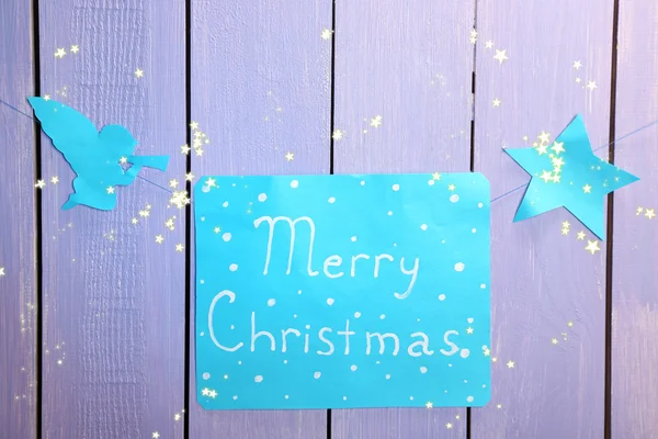 Signboard with words Merry Christmas on wooden table background close-up — Stock Photo, Image