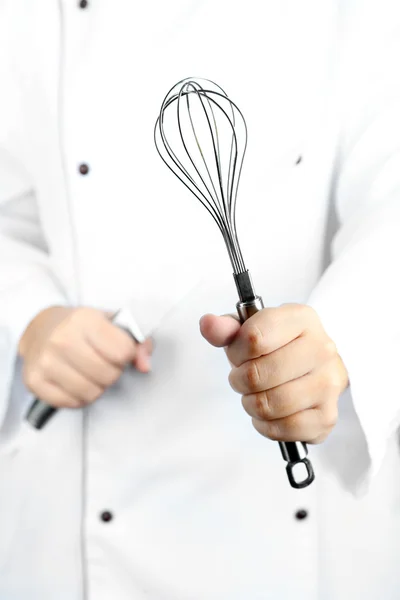 Corolla i nóż w ręce kucharz — Zdjęcie stockowe