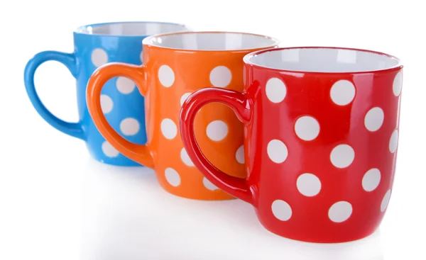 Color polka dot mugs isolated on white — Stock Photo, Image