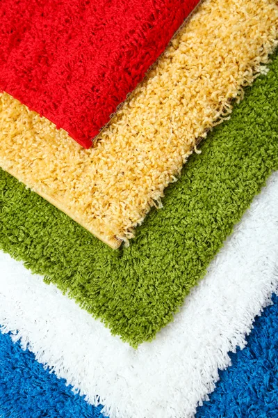 Many carpets of different colors close-up — Stock Photo, Image