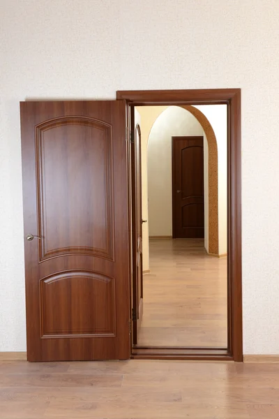 Open door in empty room Stock Image