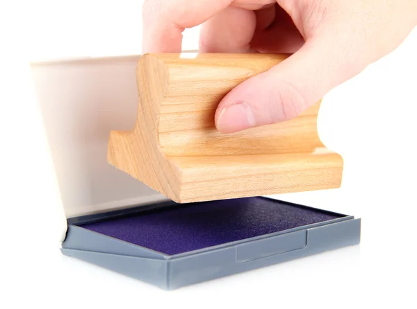 Hand met houten stempel, geïsoleerd op wit — Stockfoto