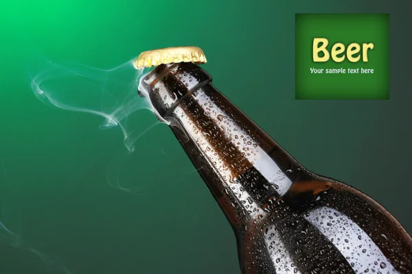 Top of open wet beer bottle on dark background — Stock Photo, Image