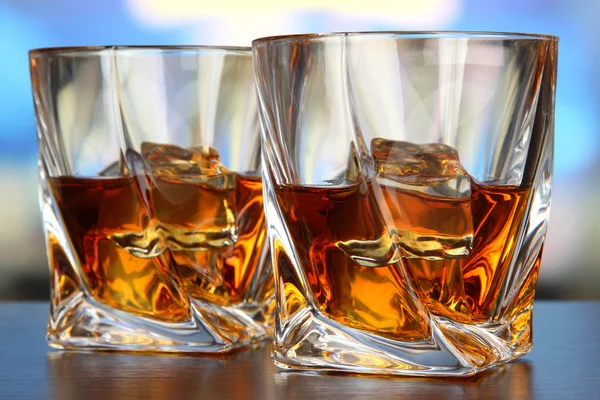 Glasses of whiskey, on bright background — Stock Photo, Image