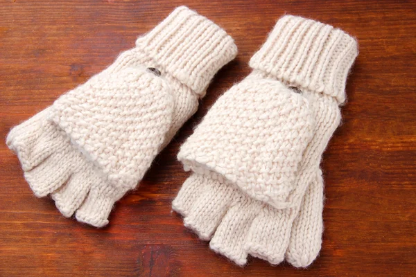 Wool fingerless gloves, on wooden background — Stock Photo, Image