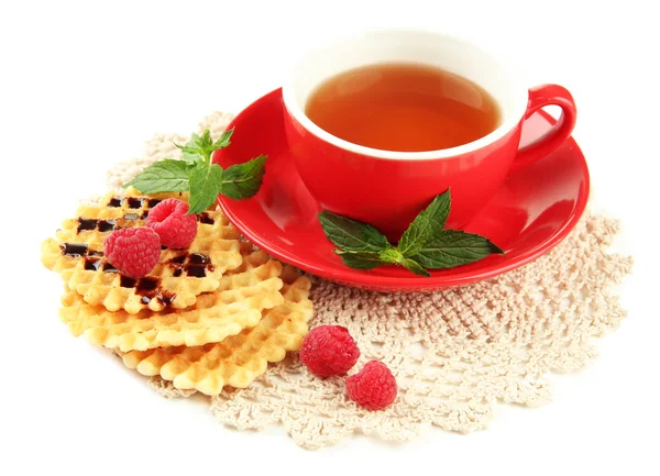 Cup of tea with cookies and raspberries isolated on white — Stock Photo, Image