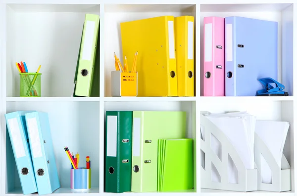 White office shelves with folders and different stationery, close up — Stock Photo, Image