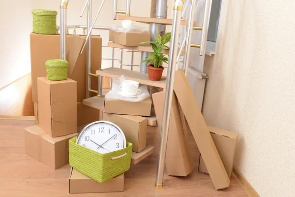 Stack of cartons near stairs: moving house concept — Stock Photo, Image