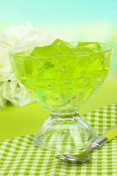 Tasty jelly cubes in bowl on table on light background — Stock Photo, Image