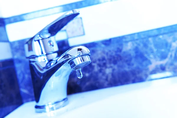 Ceramic sink with chrome fixture, close up — Stock Photo, Image