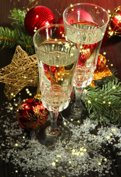 Composition with Christmas decorations and two champagne glasses, on bright background — Stock Photo, Image