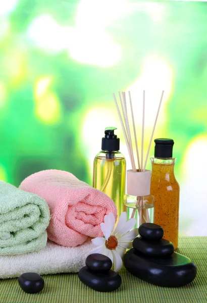 Beautiful spa setting on bamboo mat on bright background — Stock Photo, Image