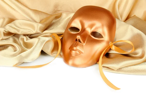 Mask on gold fabric on white background — Stock Photo, Image