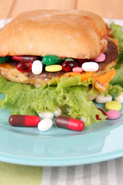 Conceptual image for nutritional care:assorted vitamins and nutritional supplements in bun. On wooden background — Stock Photo, Image