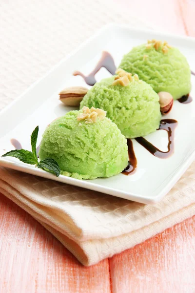 Delicious ice cream on plate on table close-up — Stock Photo, Image