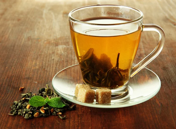 Transparent cup of green tea on wooden background — Stock Photo, Image