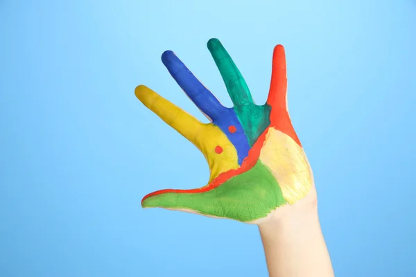 Mano pintada con sonrisa sobre fondo azul —  Fotos de Stock