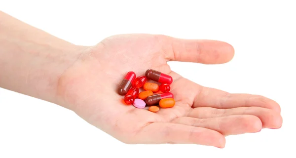 Pills in hand isolated on white — Stock Photo, Image