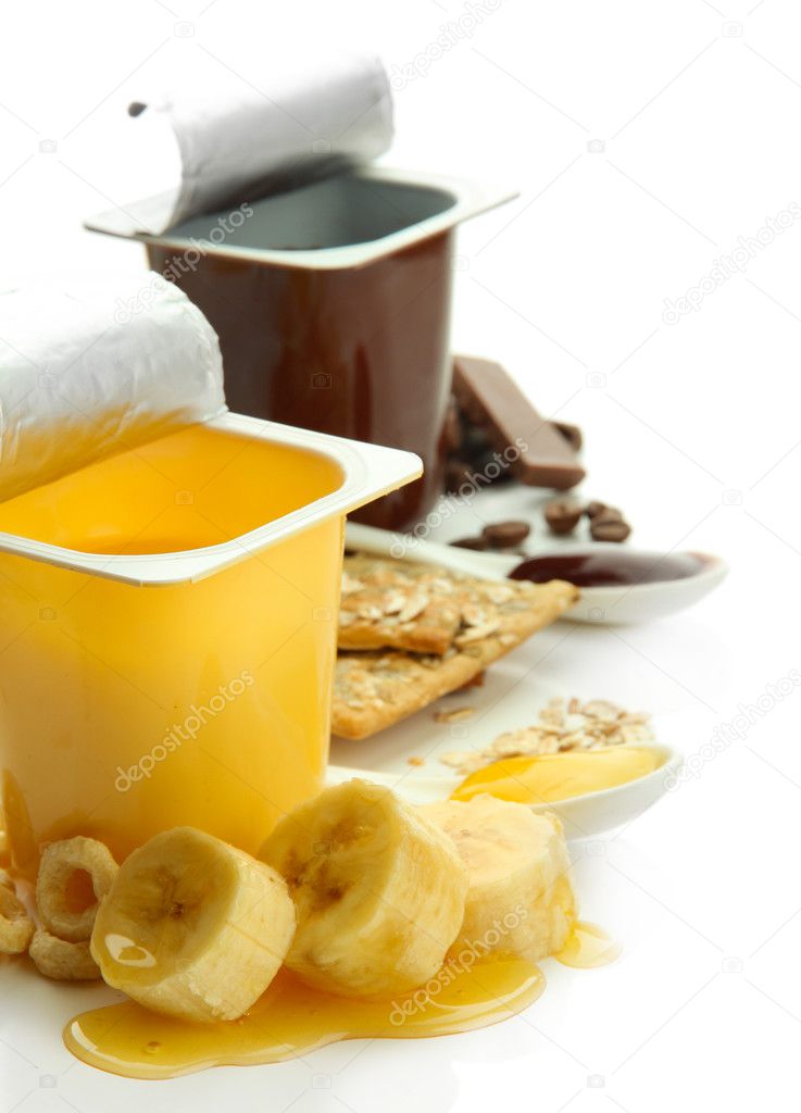 Tasty desserts in open plastic cups and banana, isolated on white