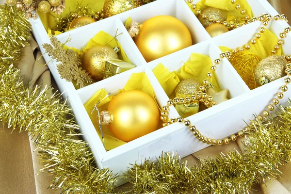 Christmas toys in wooden box close-up — Stock Photo, Image