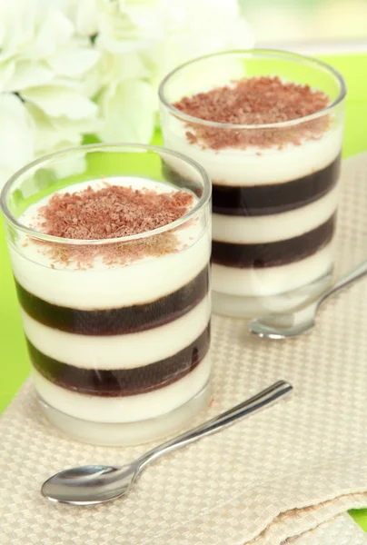 Tasty jelly coffee with milk on table on light background — Stock Photo, Image