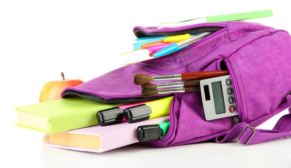 Purple backpack with school supplies isolated on white — Stock Photo, Image