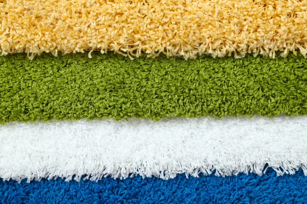 Muchas alfombras de diferentes colores de cerca —  Fotos de Stock