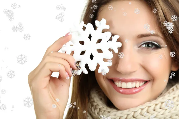 Beautiful smiling girl with Christmas snowflake isolated on white — Stock Photo, Image