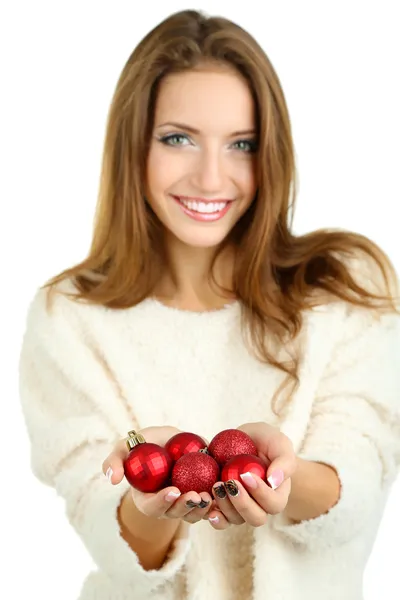 Menina sorridente bonita com brinquedos de Natal isolado no branco — Fotografia de Stock