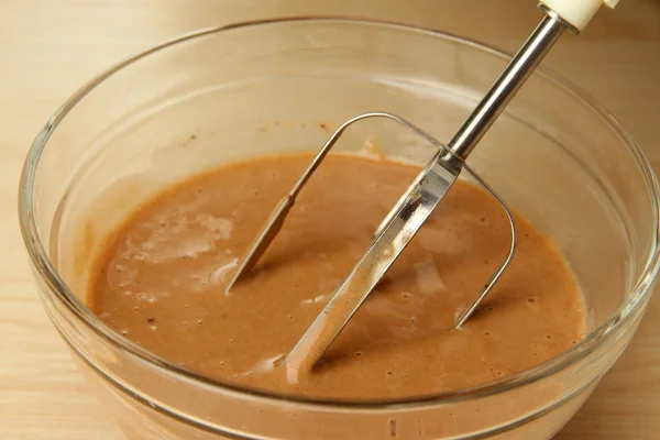 Cooking, whipping eggs with electric whisk in bowl, close up — Stock Photo, Image