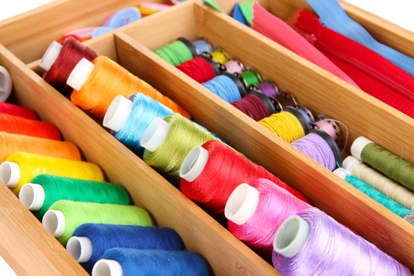 Colorful threads for needlework in wooden box close up — Stock Photo, Image