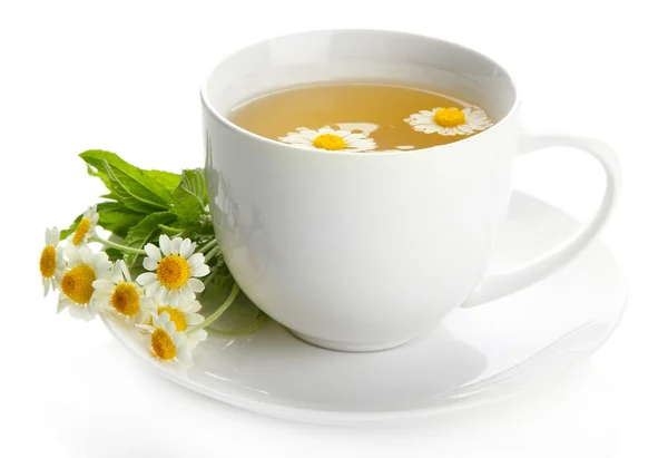 Cup of herbal tea with wild camomiles and mint, isolated on white — Stock Photo, Image