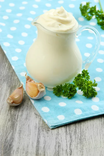 Sour cream in pitcher on table close-up — Stock Photo, Image