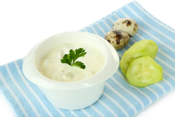 Cucumber yogurt in glass bowl, on color napkin, isolated on white — Stock Photo, Image