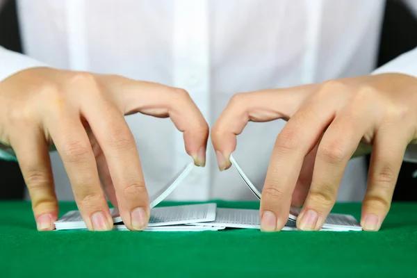 Playing cards in hands — Stock Photo, Image