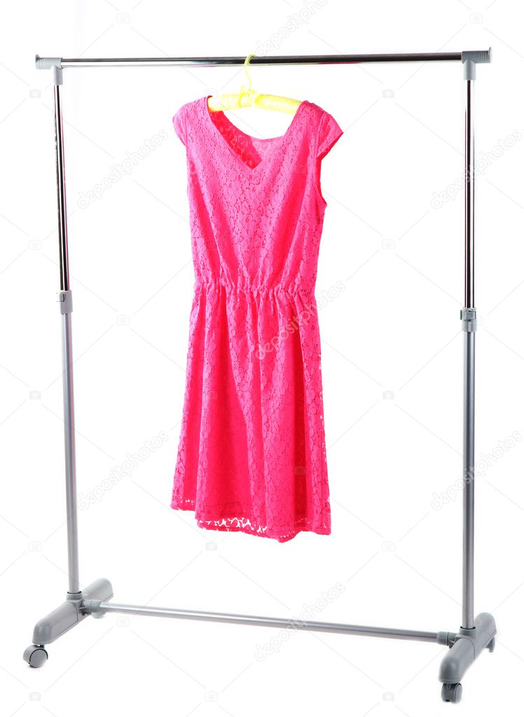 Pink dress hanging on hangers
