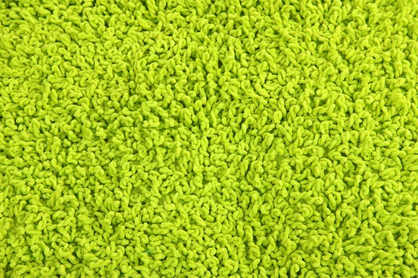 Fleecy green pillow close-up background — Stock Photo, Image