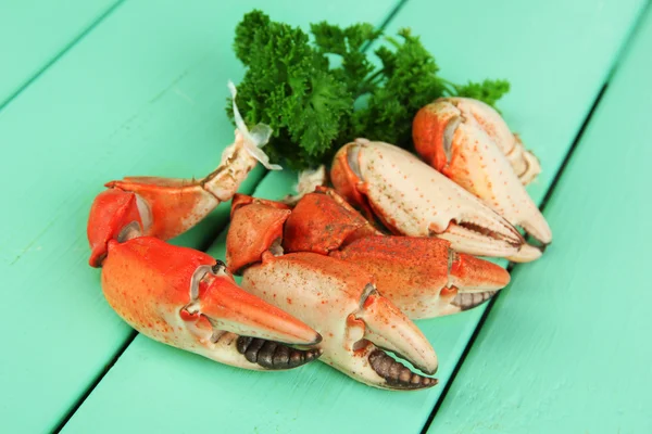 Boiled crab claws ,on wooden table background