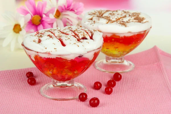 Tasty jelly in bowls on table on light background — Stock Photo, Image