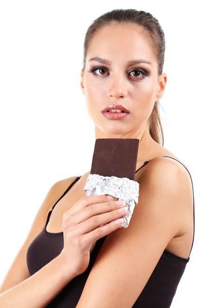 Portrait of beautiful young girl with chocolate isolated on white — Stock Photo, Image