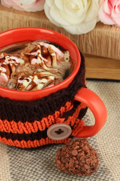 Cup with knitted thing on it close up — Stock Photo, Image